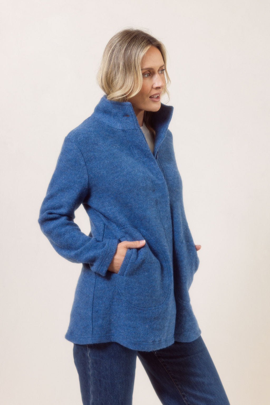 Women wearing a boiled wool funnel neck See Saw Coat against a white background
