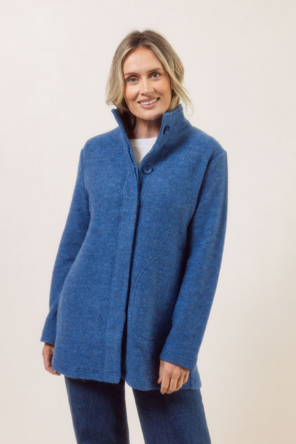 Women wearing a boiled wool funnel neck See Saw Coat against a white background
