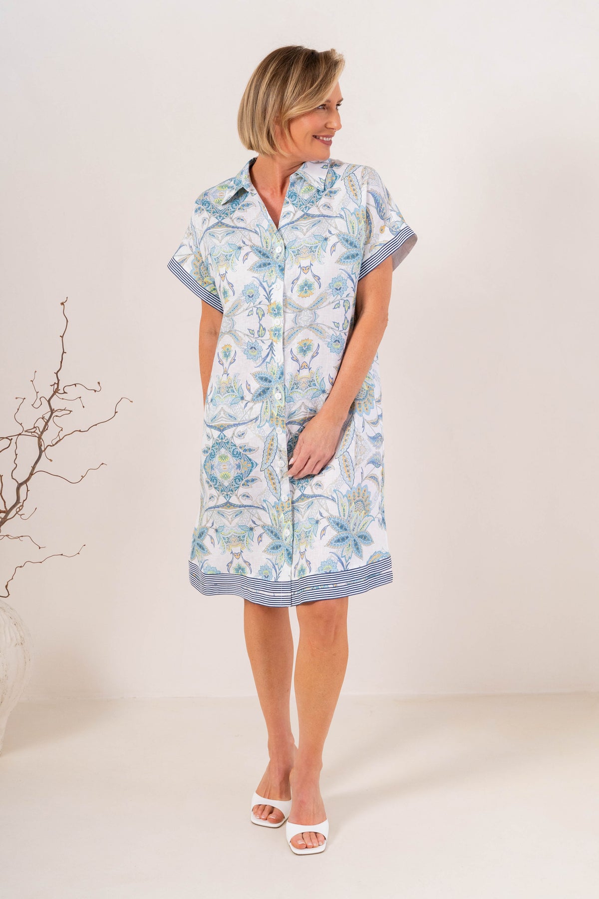 Shop the Botanica Lace Trim Linen Dress by See Saw. A linen shift in soft blue paisley with circle lace trim, a notched V-neck and short sleeves.