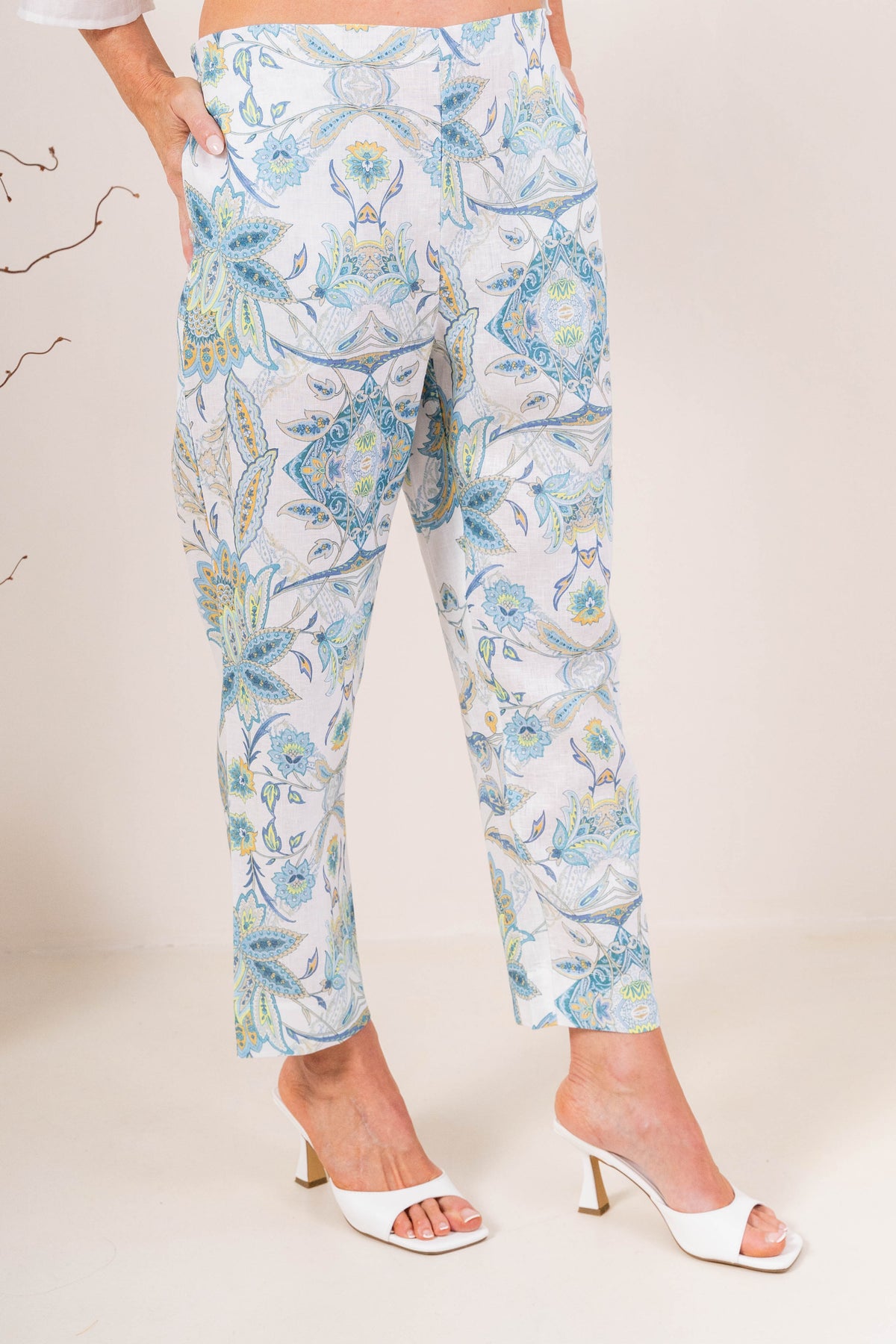 Model wearing botanica linen pants by see saw clothing. modelled against a neutral background.