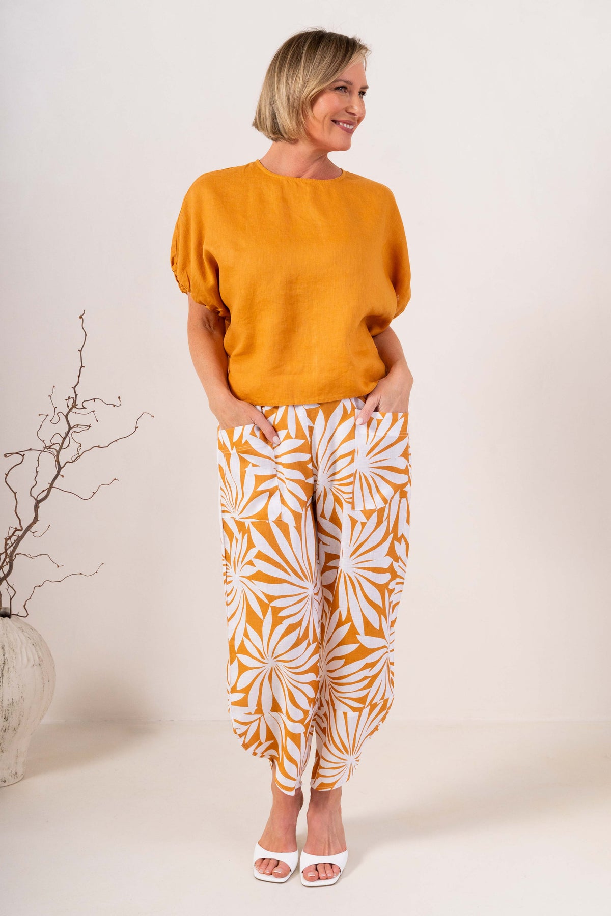 Model wearing marigold 100% linen elastic sleeve top with summer days linen pant by See Saw