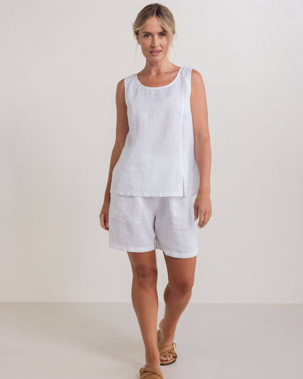 Woman wearing a white sleeveless top and beige wide-leg pants on a plain background
See Saw Linen Shell Tank Top White SS320
