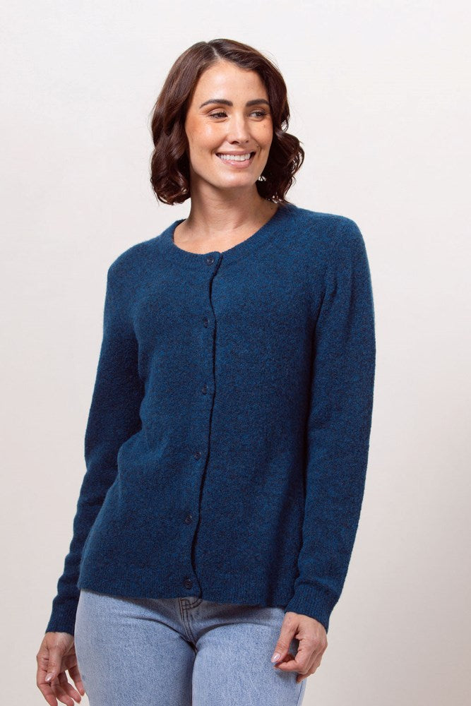 Woman wearing a blue See Saw Llama blend cardigan against a plain background