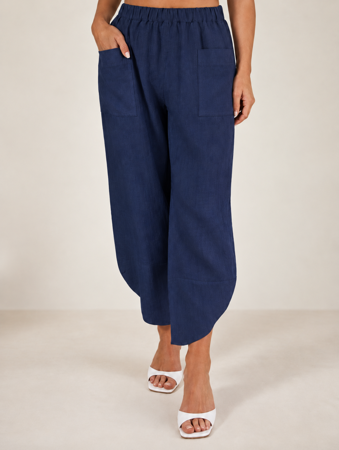 Women wearing 100% linen pocket front 7/8 pant by See Saw Clothing against a neutral background