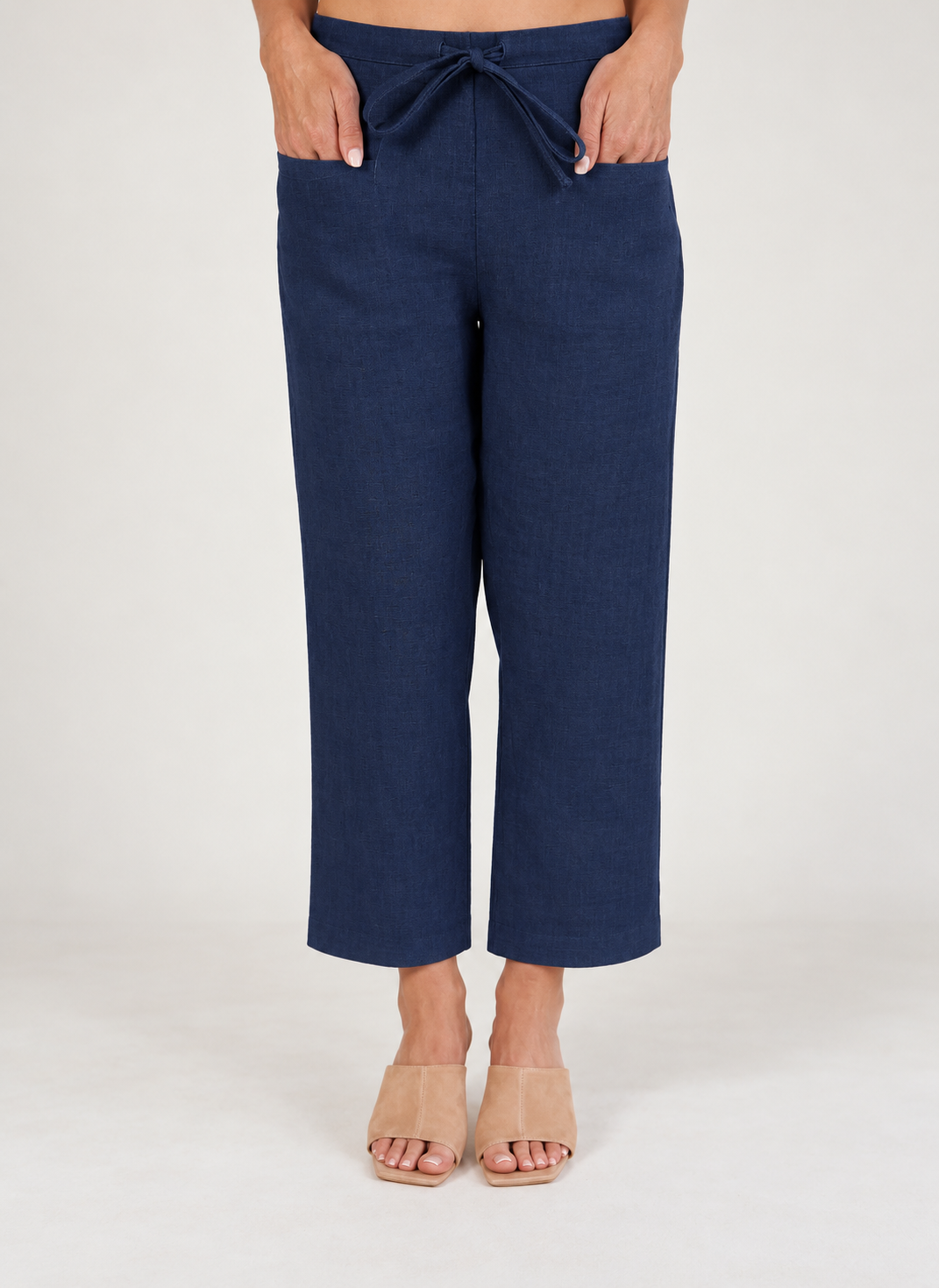 Woman wearing navy 100% linen pants by See Saw clothing.