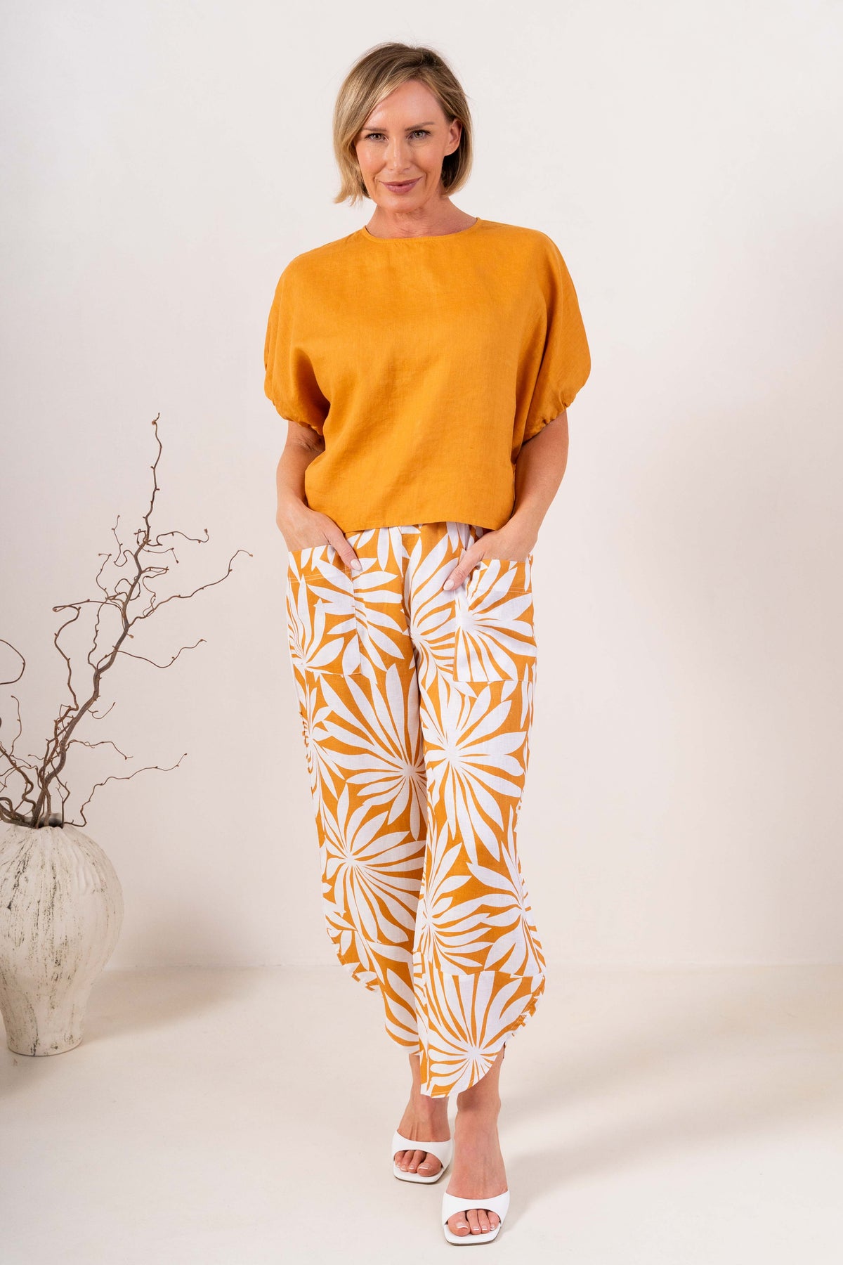 Model wearing marigold 100% linen elastic sleeve top with summer days linen pant by See Saw