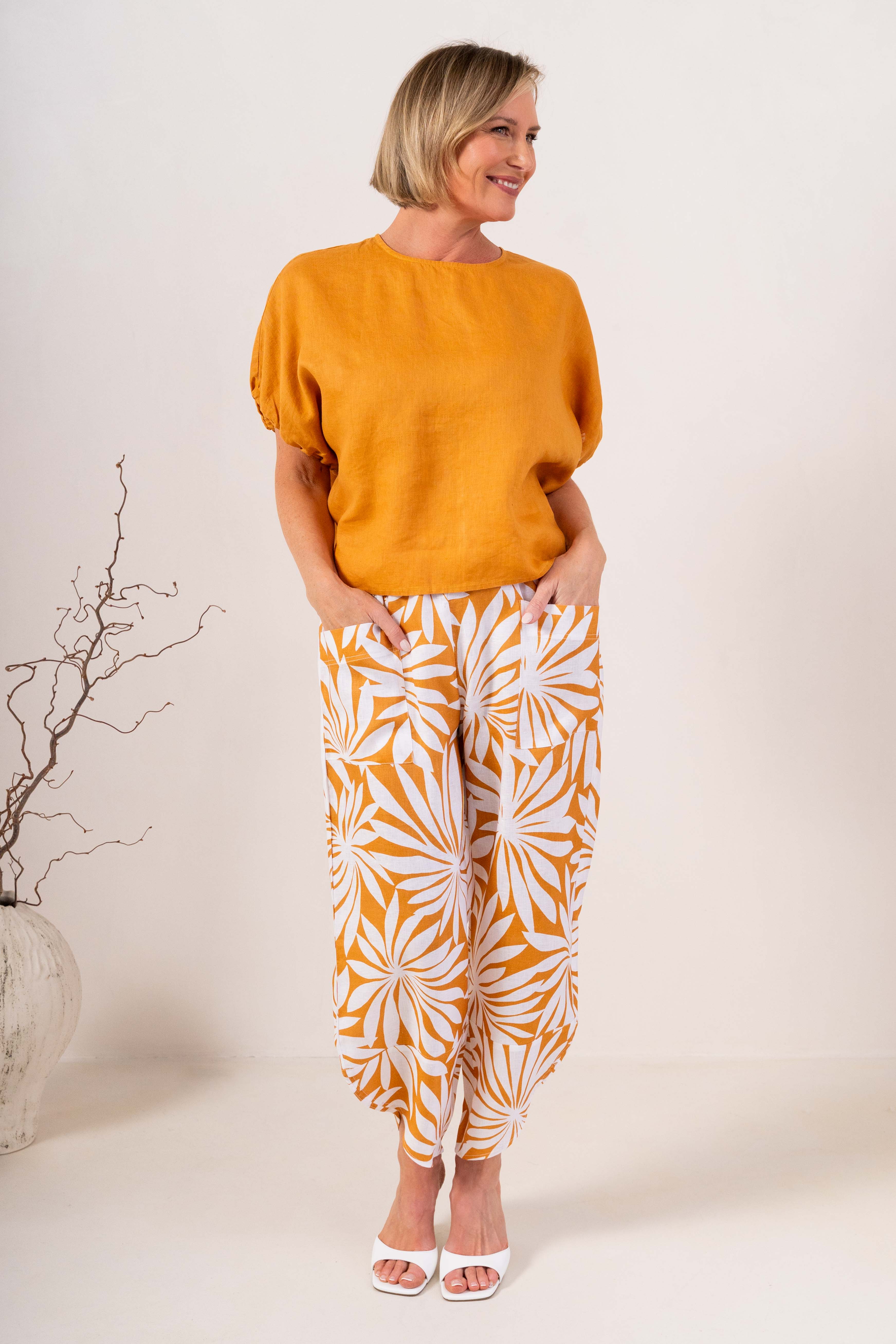 Model wearing marigold 100% linen elastic sleeve top with summer days linen pant by See Saw