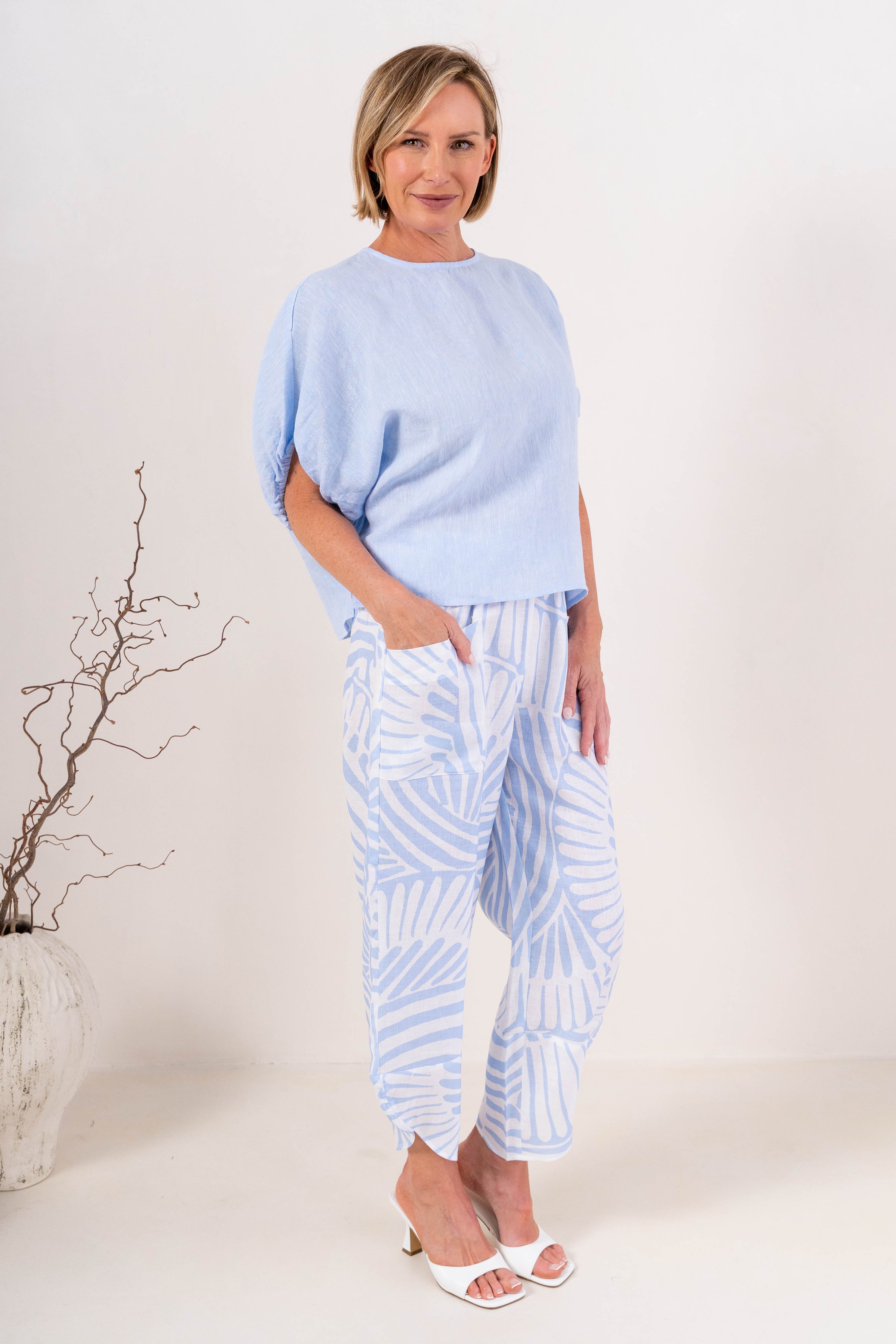 Model wearing sky blue 100% linen elastic sleeve top with summer days linen pant by See Saw